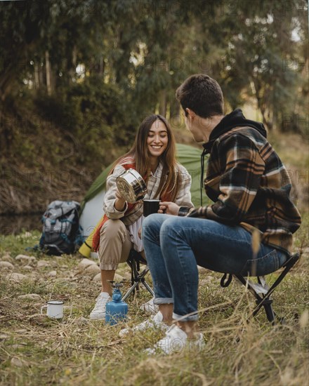 Happy couple forest being together camping