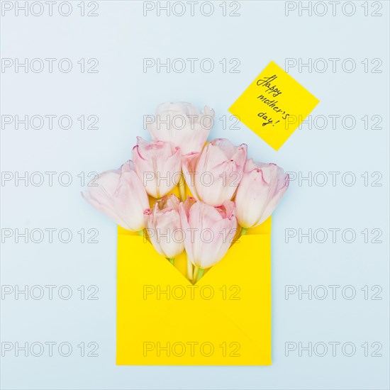 Happy mothers day inscription with tulips envelope