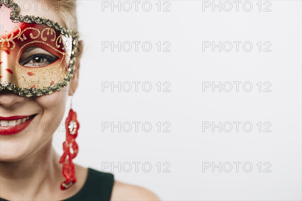 Happy woman bright red carnival mask