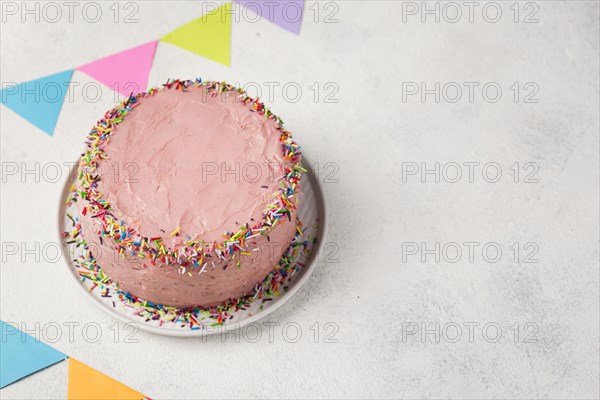 High angle decoration with pink cake birthday party