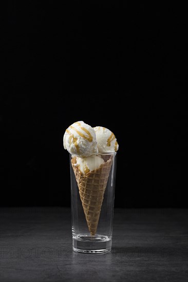 High angle ice cream cone served glass