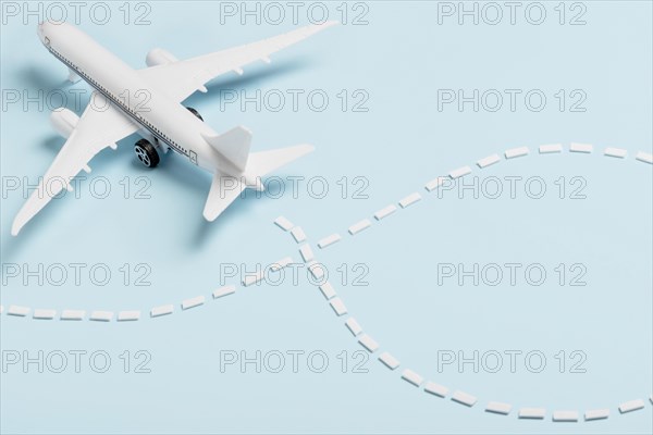 High angle small plane blue background