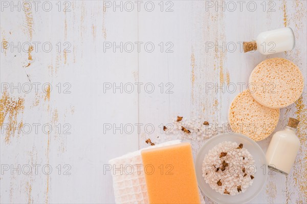 House cleaning tools near pink salt wooden table