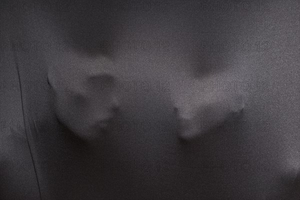 Imprints human faces gray cloth