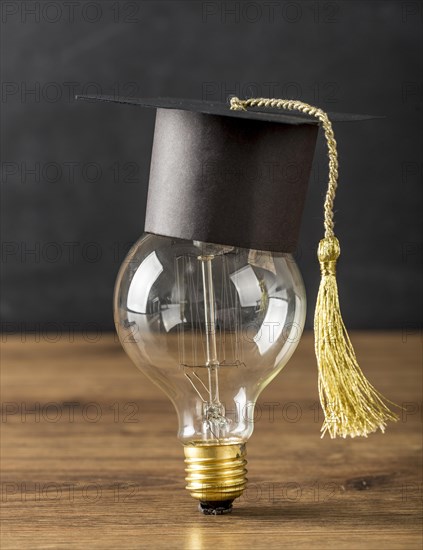 Light bulb with graduation cap
