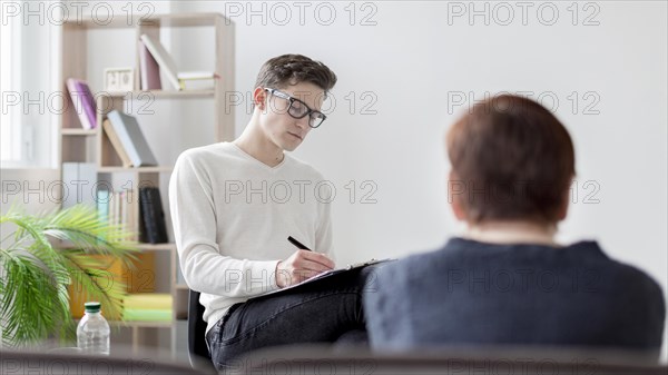 Low angle woman psychologist