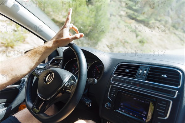 Man hand steering wheel