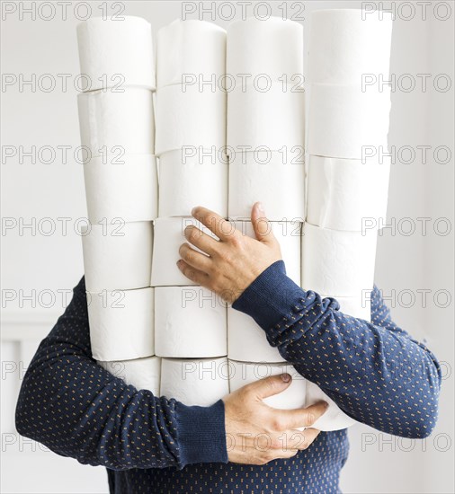 Man with stack toilet paper