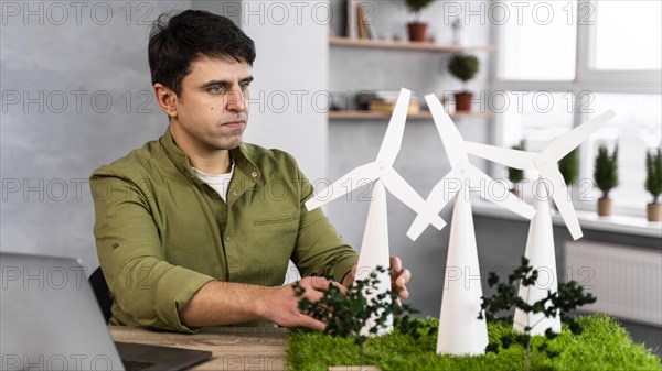 Man working eco friendly wind power project