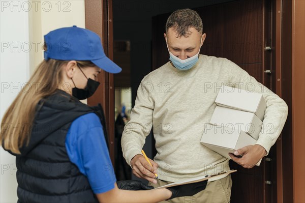 Medium shot man receiving boxes