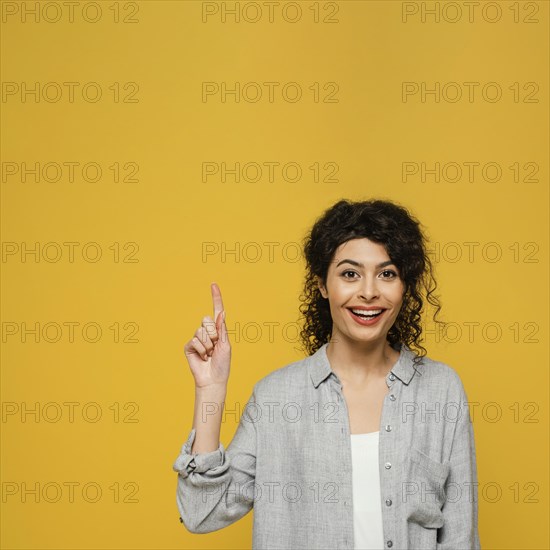 Medium shot woman pointing up