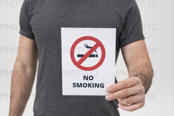 Mid section man showing no smoking sign isolated white backdrop