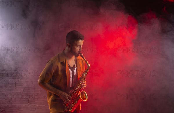 Musician fog playing saxophone