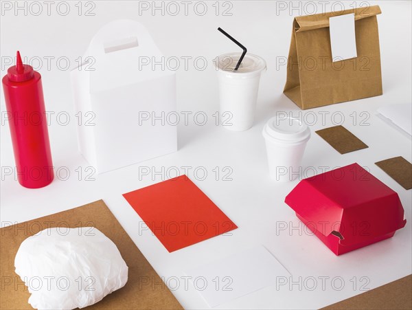 Packed food with disposal cup sauce bottle white background