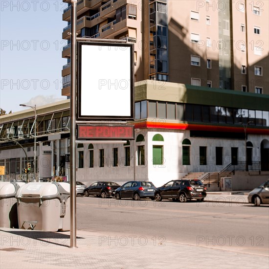 Pole with advertising billboard city street