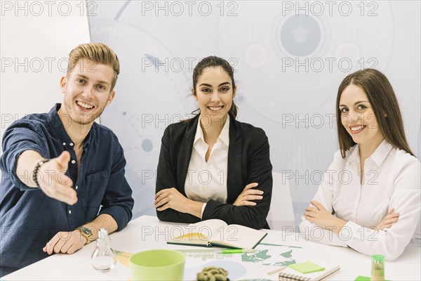 Portrait happy male female businesspeople looking camera