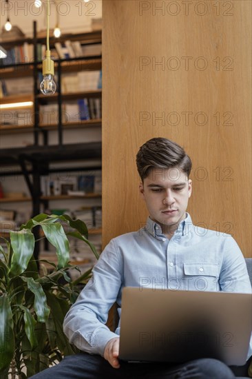 Portrait man working laptop