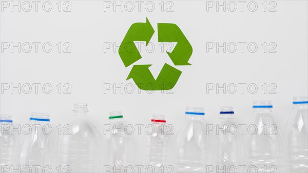 Recycle symbol plastic bottles grey backgound