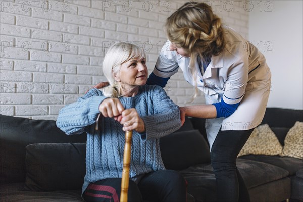 Retirement home concept with nurse woman