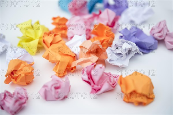 Scattered crumple paper white background