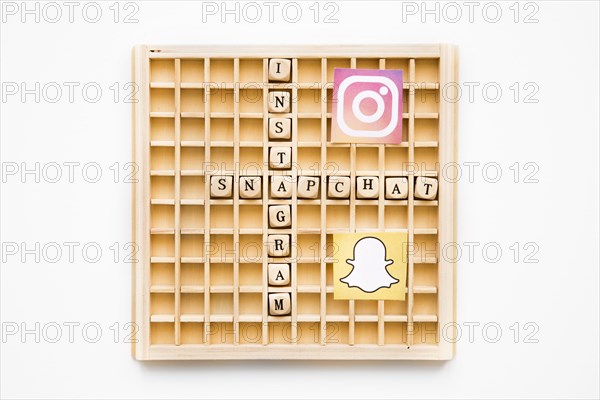 Scrabble wooden game showing instagram snapchat words with their icons