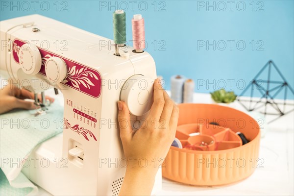 Sewing machine with blue background