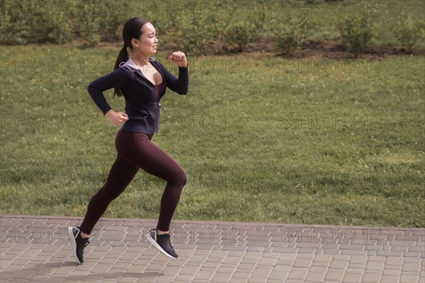 Side view young woman running outdoors