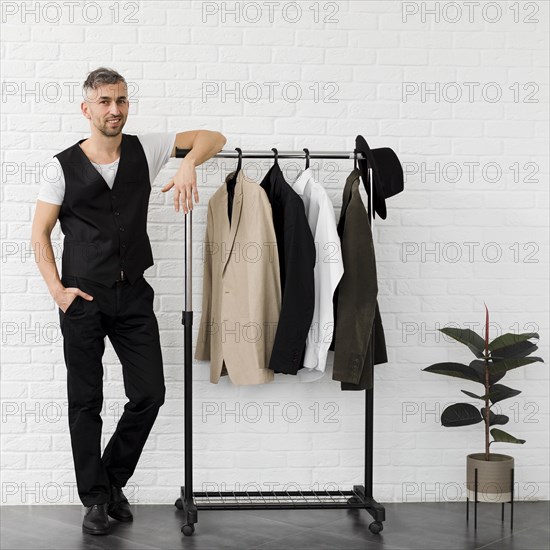 Stylish man surrounded by minimalist decor