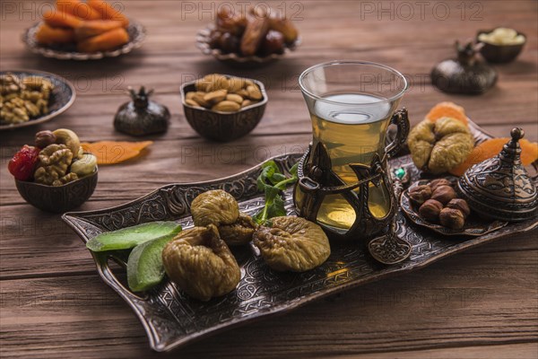 Tea glass with dried figs nuts tray