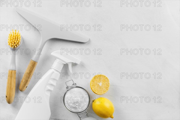 Top view cleaning products with baking soda lemon