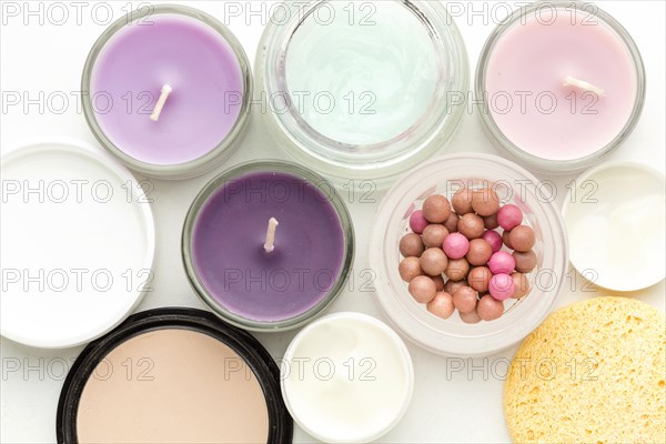 Top view collection cosmetic products candles