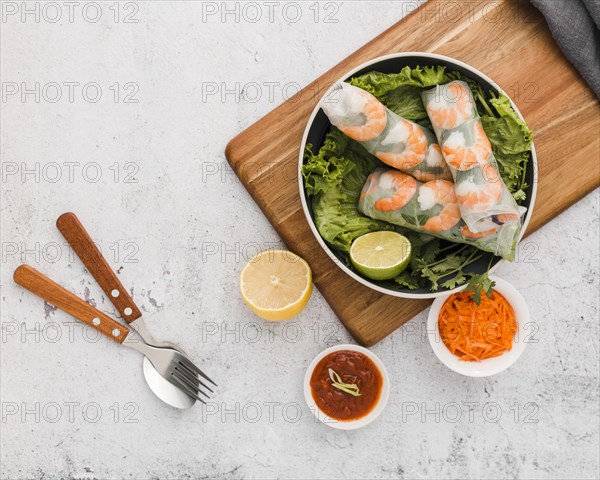 Top view fresh shrimp rolls bowl with sauce