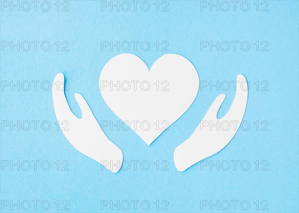 Top view paper heart with paper hands