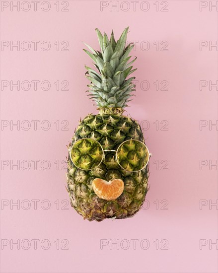 Top view pineapple with sunglasses