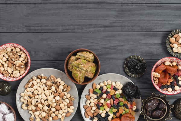 Traditional arabic ramadan baklava dried fruits nuts served wooden table