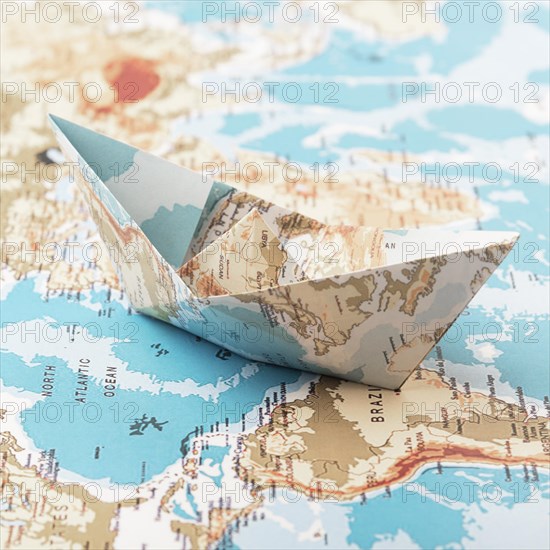 Travel concept with paper boat