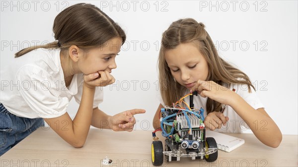 Two girls doing science experiments together
