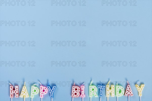 Unlit birthday candles with letters