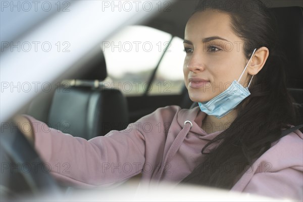 Woman car use properly mask