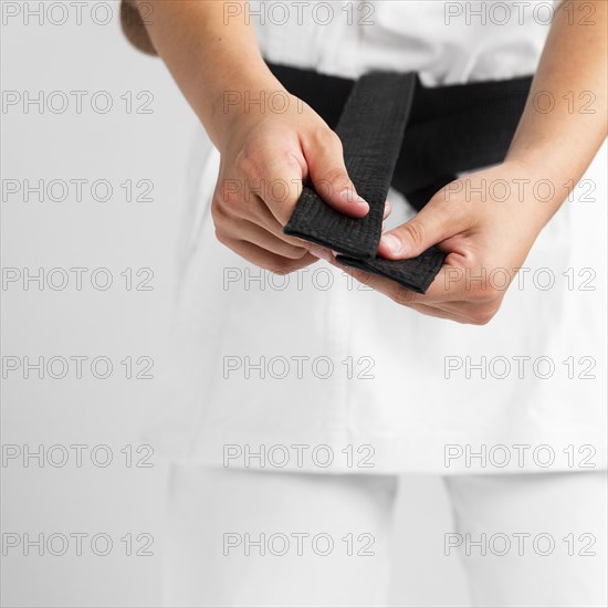 Woman getting dressed uniform close up