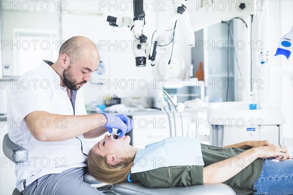 Woman going through dental treatment with expander