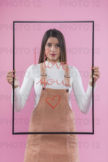 Woman holding glass with i love you inscription