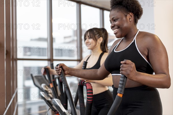 Women exercising treadmill