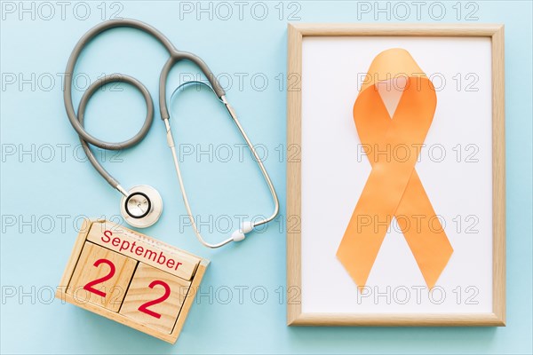 Wooden block calendar 22nd september stethoscope orange ribbon multiple awareness