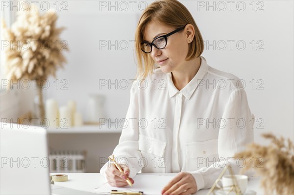 Young woman writing book