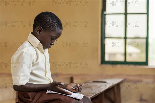 African kid learning class
