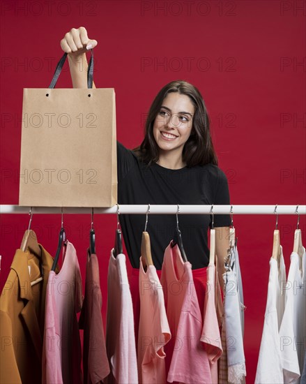 Beautiful woman looking her shopping bag