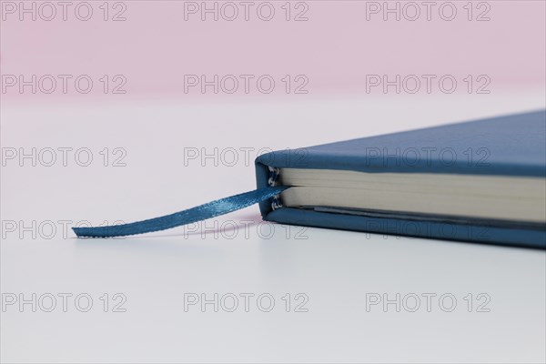 Book close up with pink background