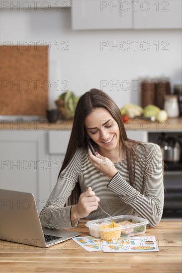 Businesswoman trying eat work