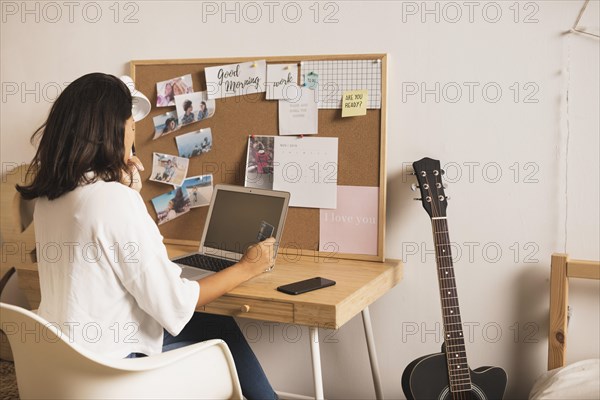 Casual dressed woman working from home
